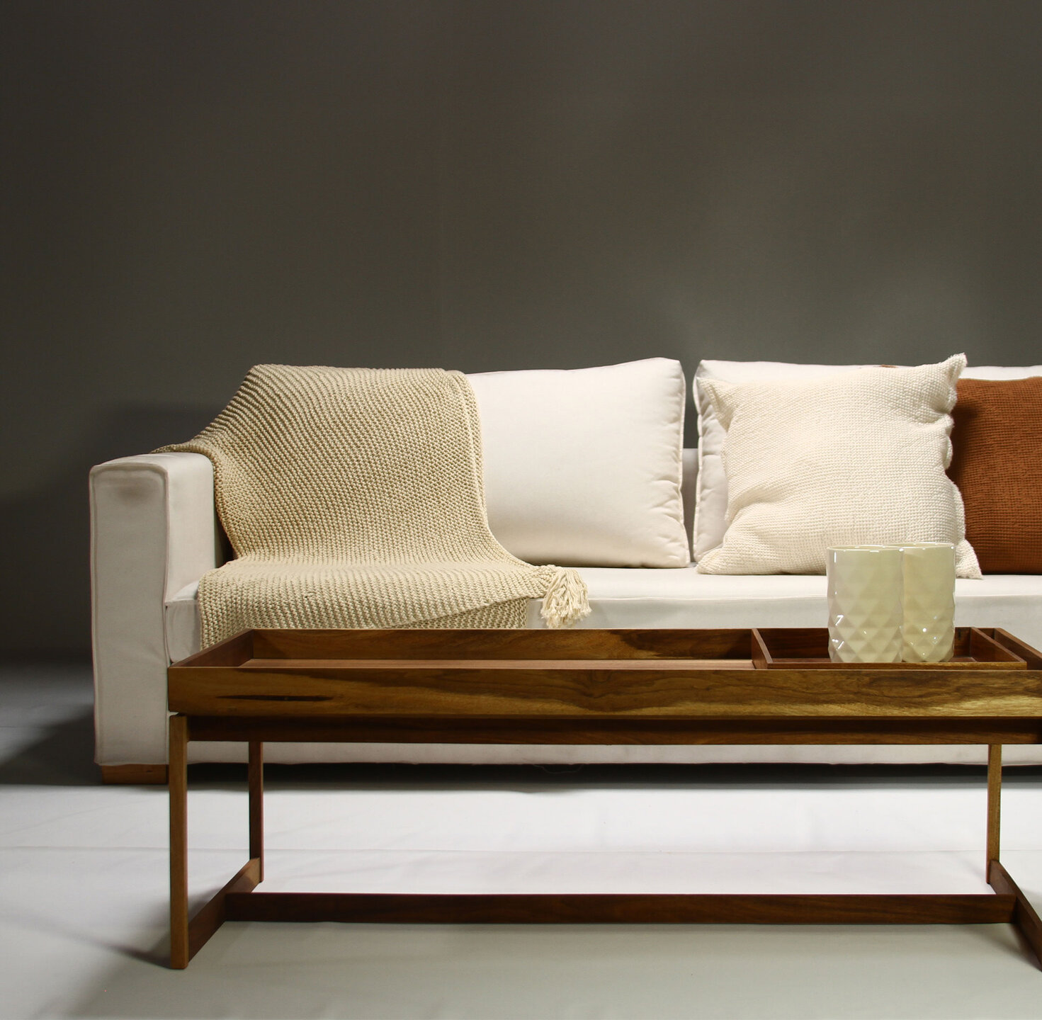 Furniture, Wood, Couch, Flooring, Brown, Floor, Living room, Cushion, Throw pillow, Daybed